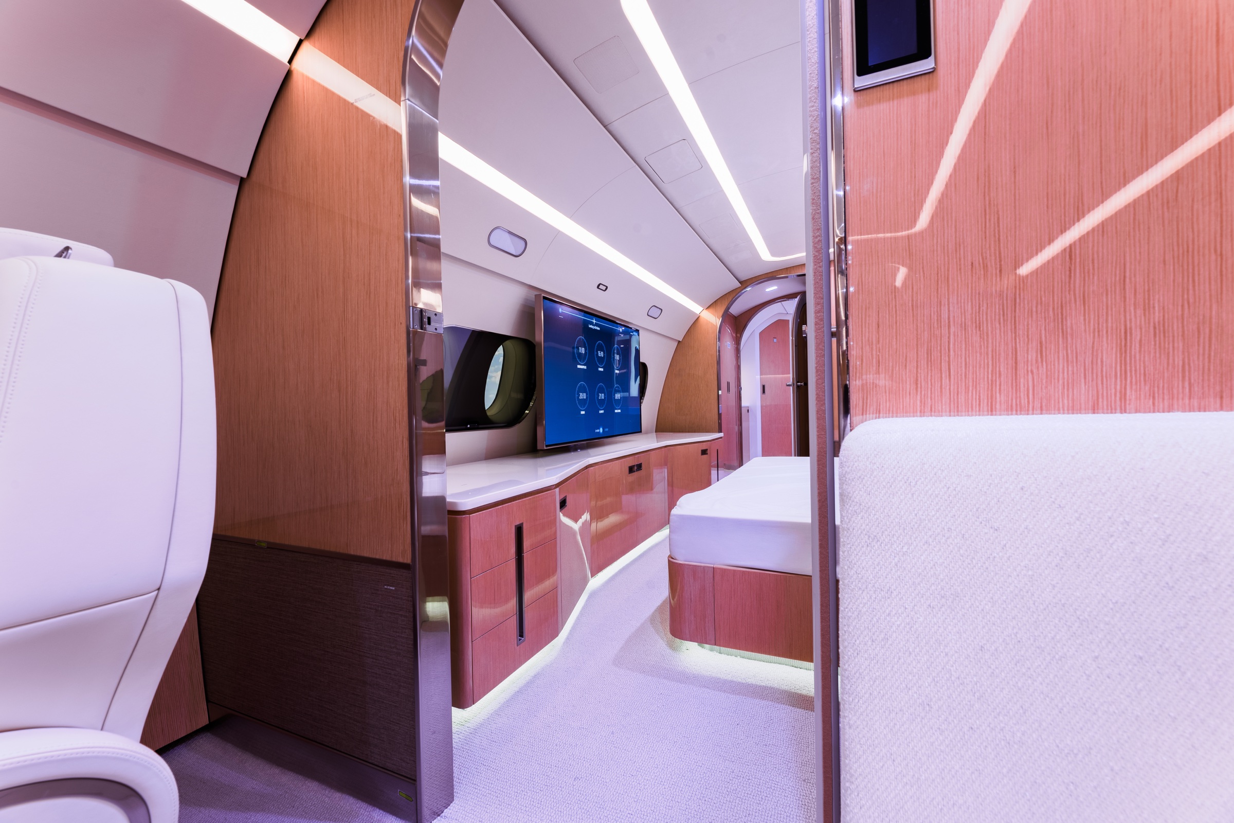 ACJ220 entertainment area and illuminated wood cabinetry