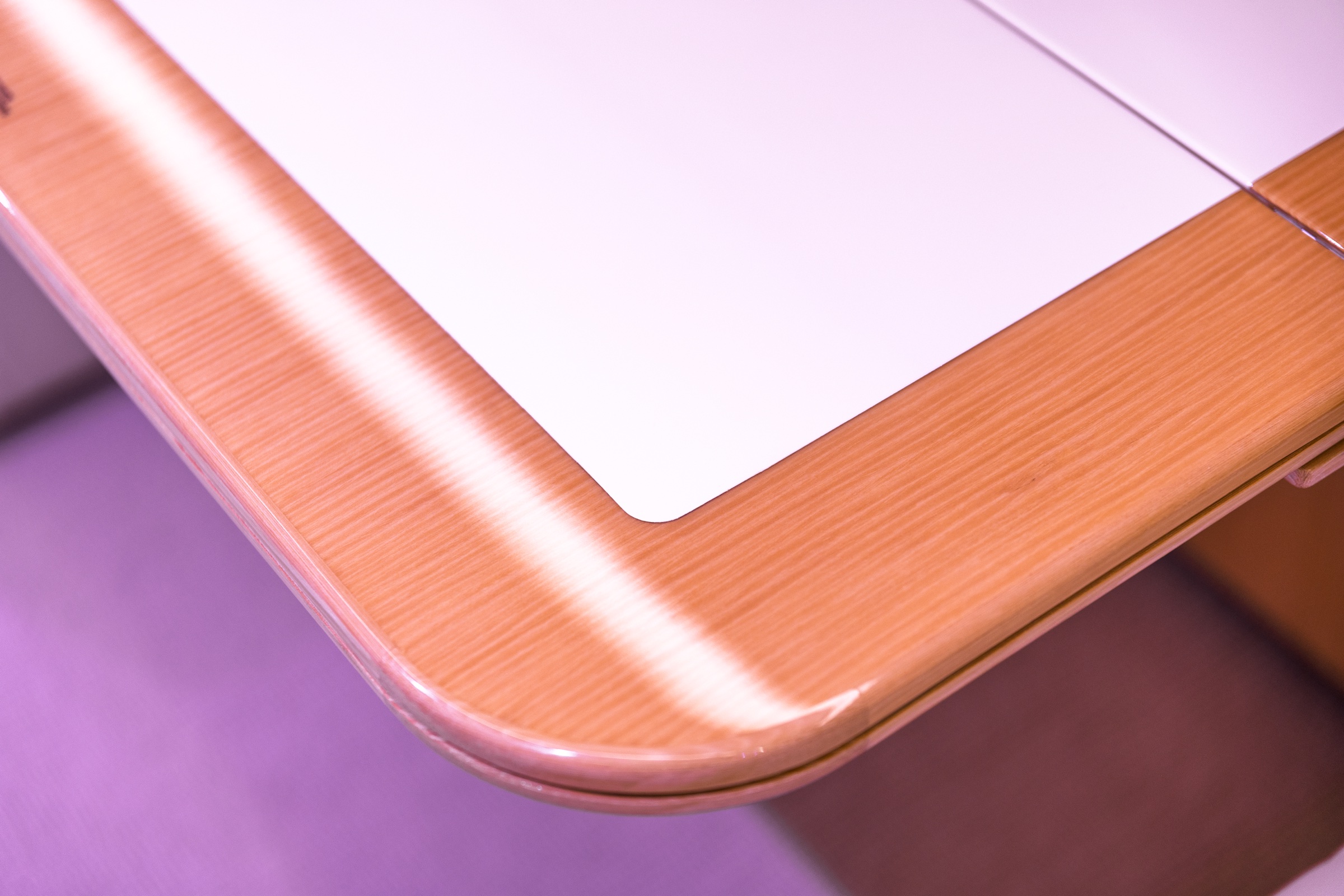 Detail of the ACJ220 cabin table and high-gloss wood finish