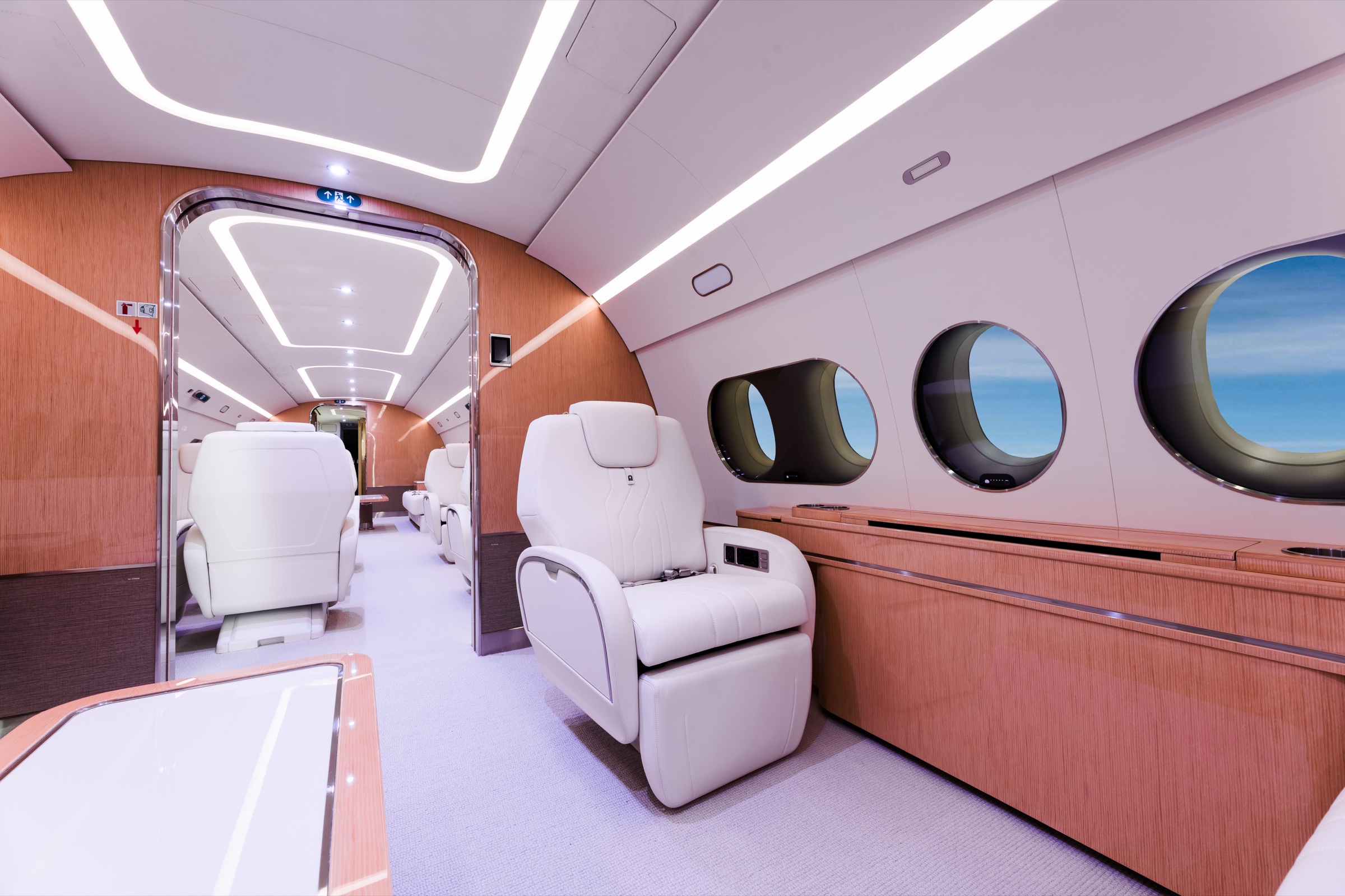 ACJ220 lounge seat, panoramic windows, and custom cabinetry