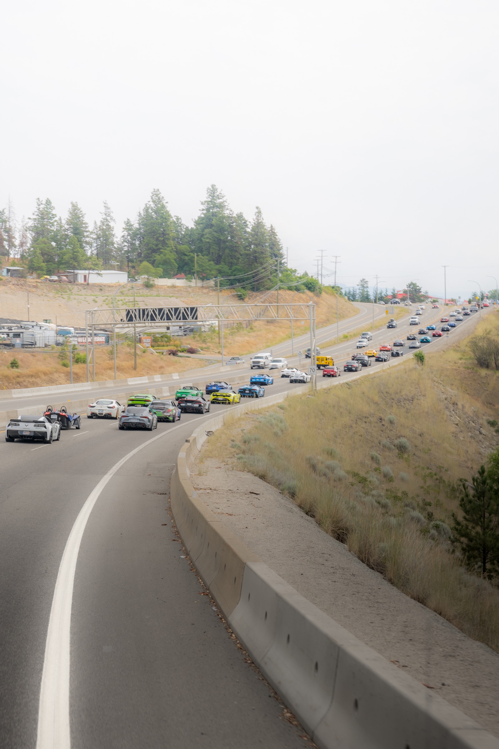 The Okanagan Dream Rally convoy stretching along Highway 97