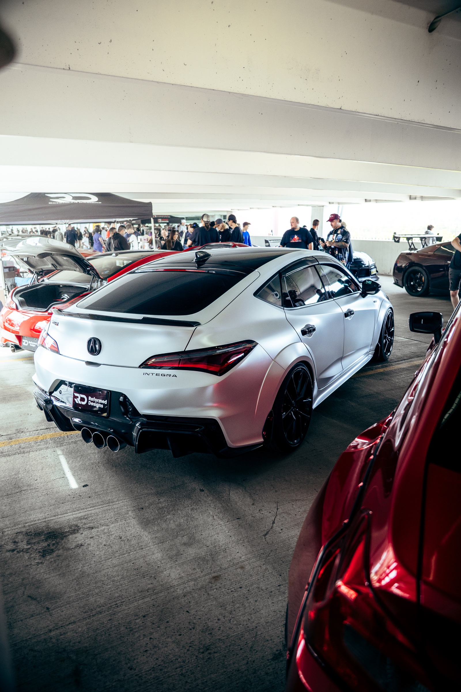 Rear three-quarter view of a silver Acura Integra