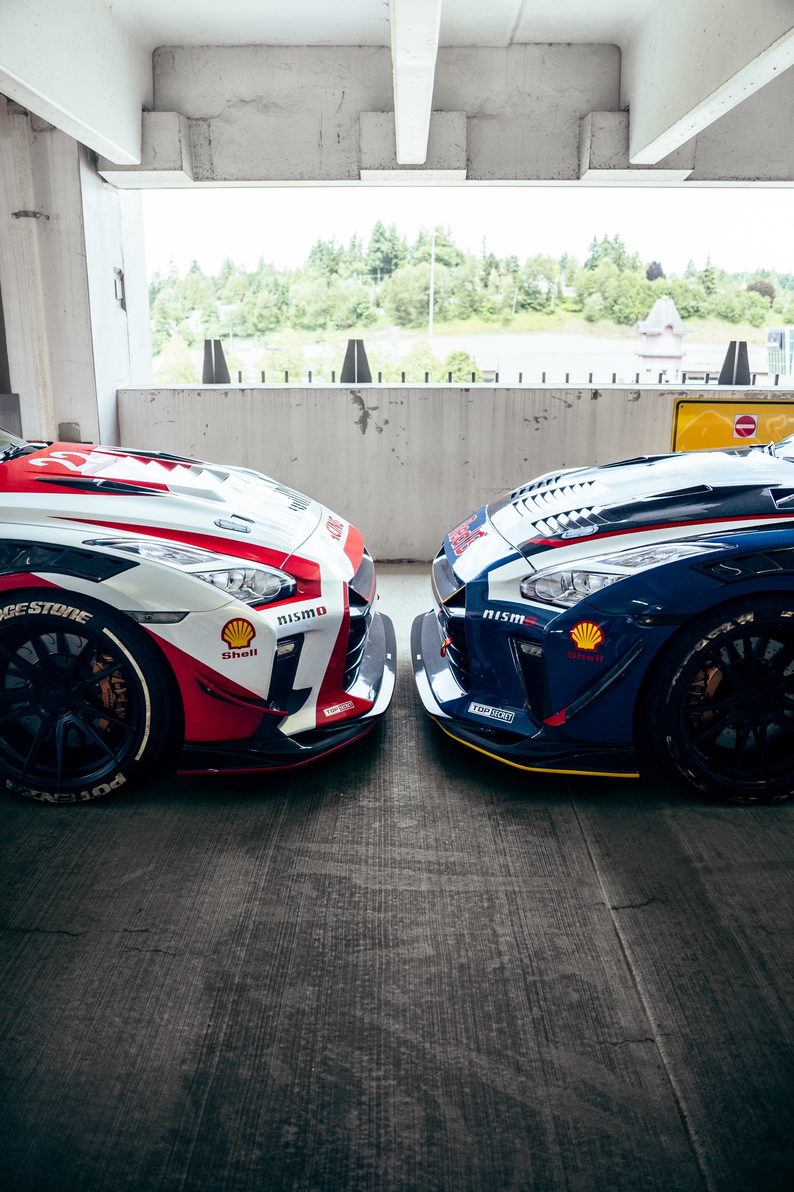 Two race-liveried Nissan GT-Rs facing one another