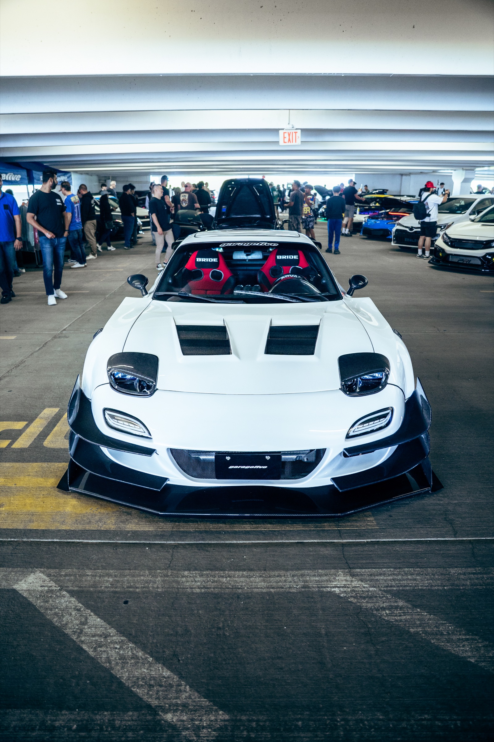 White widebody Mazda RX-7 photographed head-on