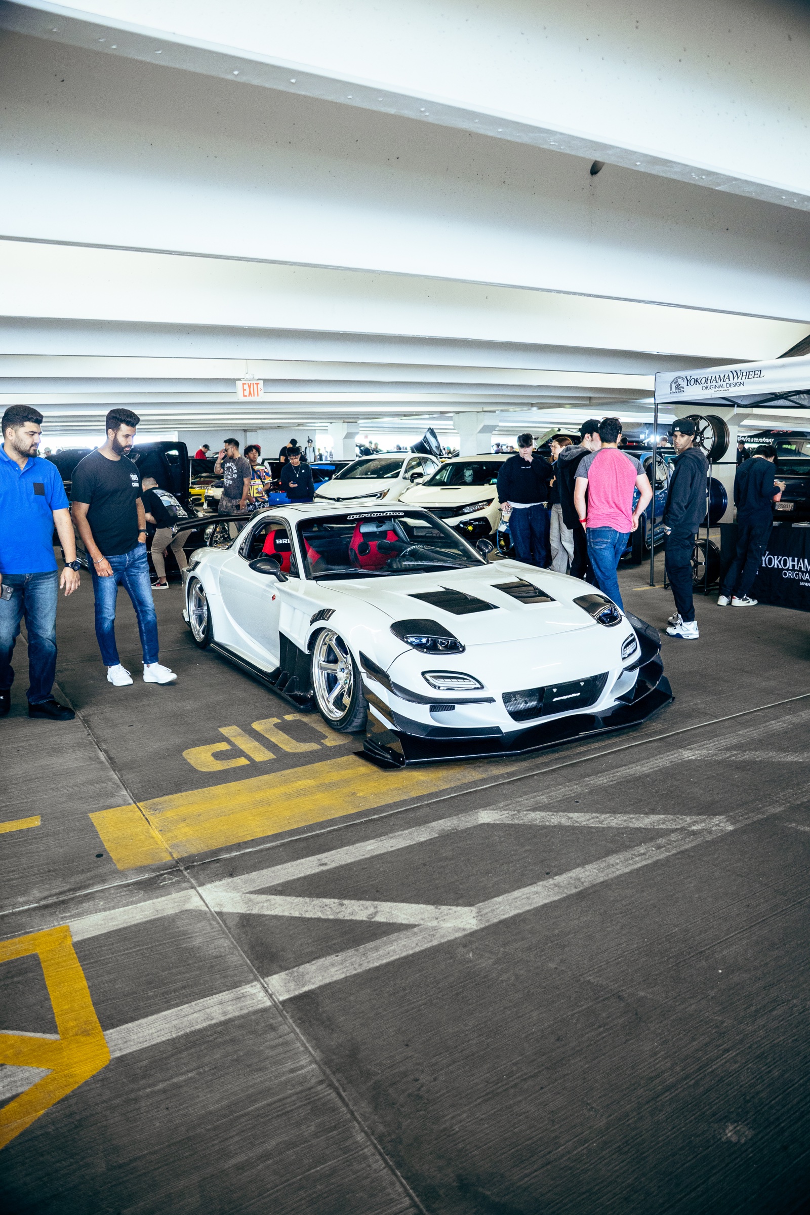 White Mazda RX-7 displayed among the Driven Vancouver crowd