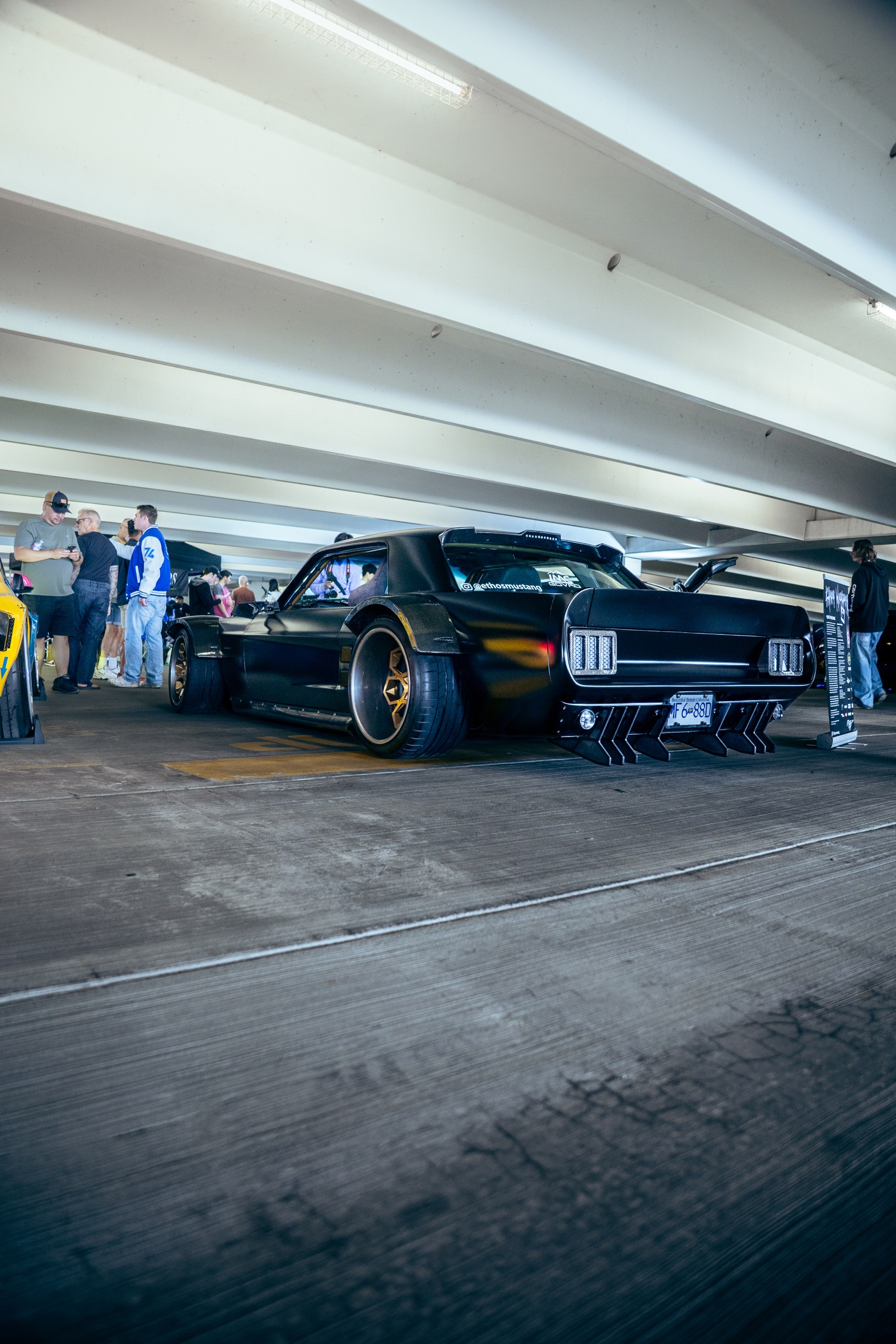 Black custom widebody Mustang inside Driven Vancouver