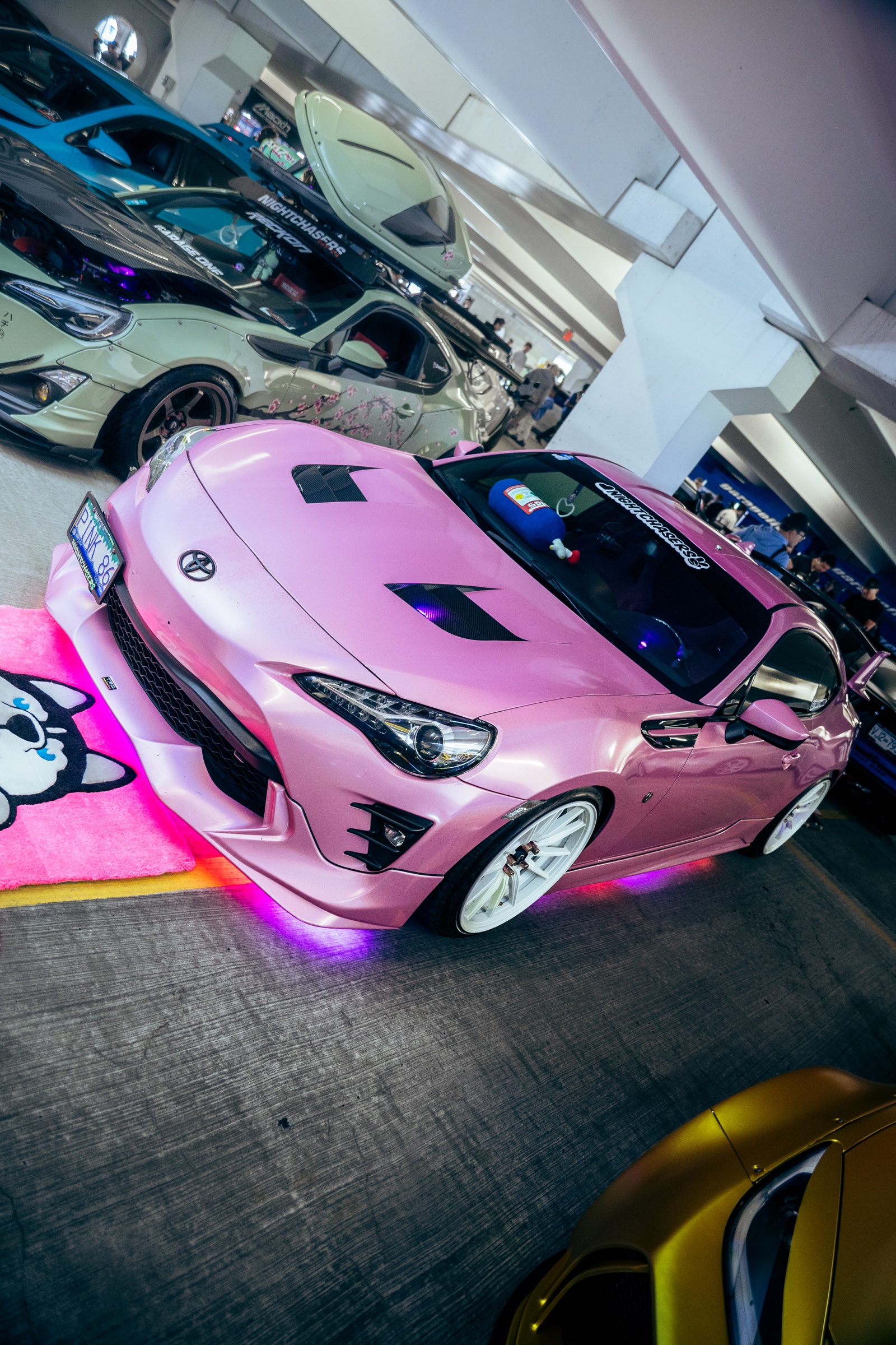 Pink Toyota 86 displayed with underglow and custom details