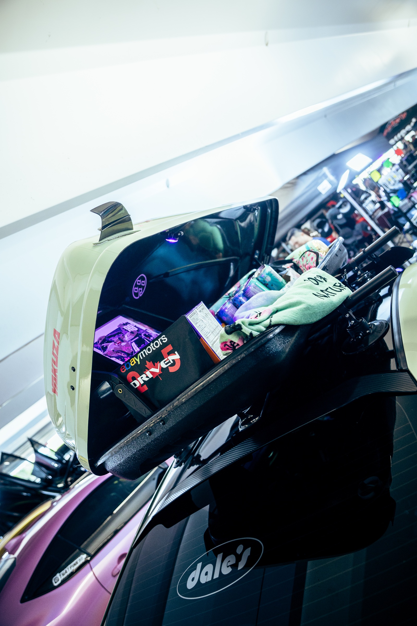 Open show-car hatch filled with automotive merchandise