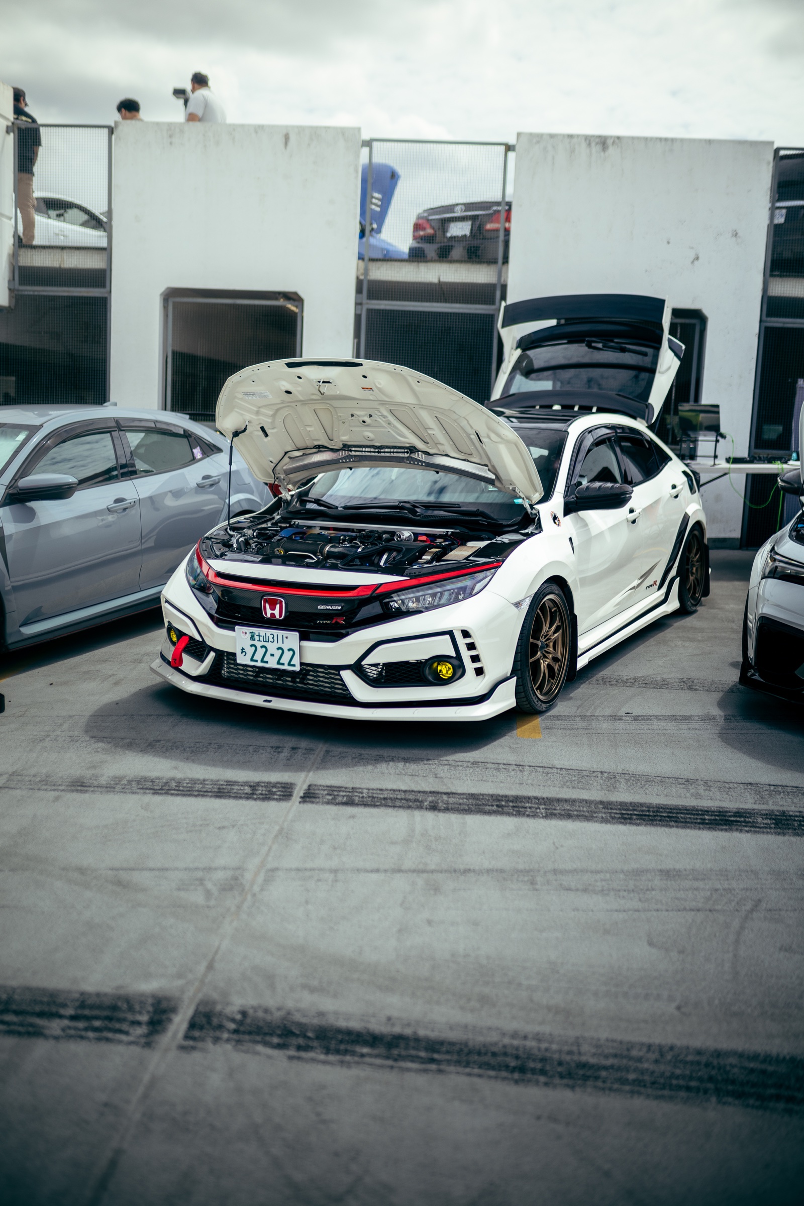White Honda Civic Type R displayed with its hood and hatch open