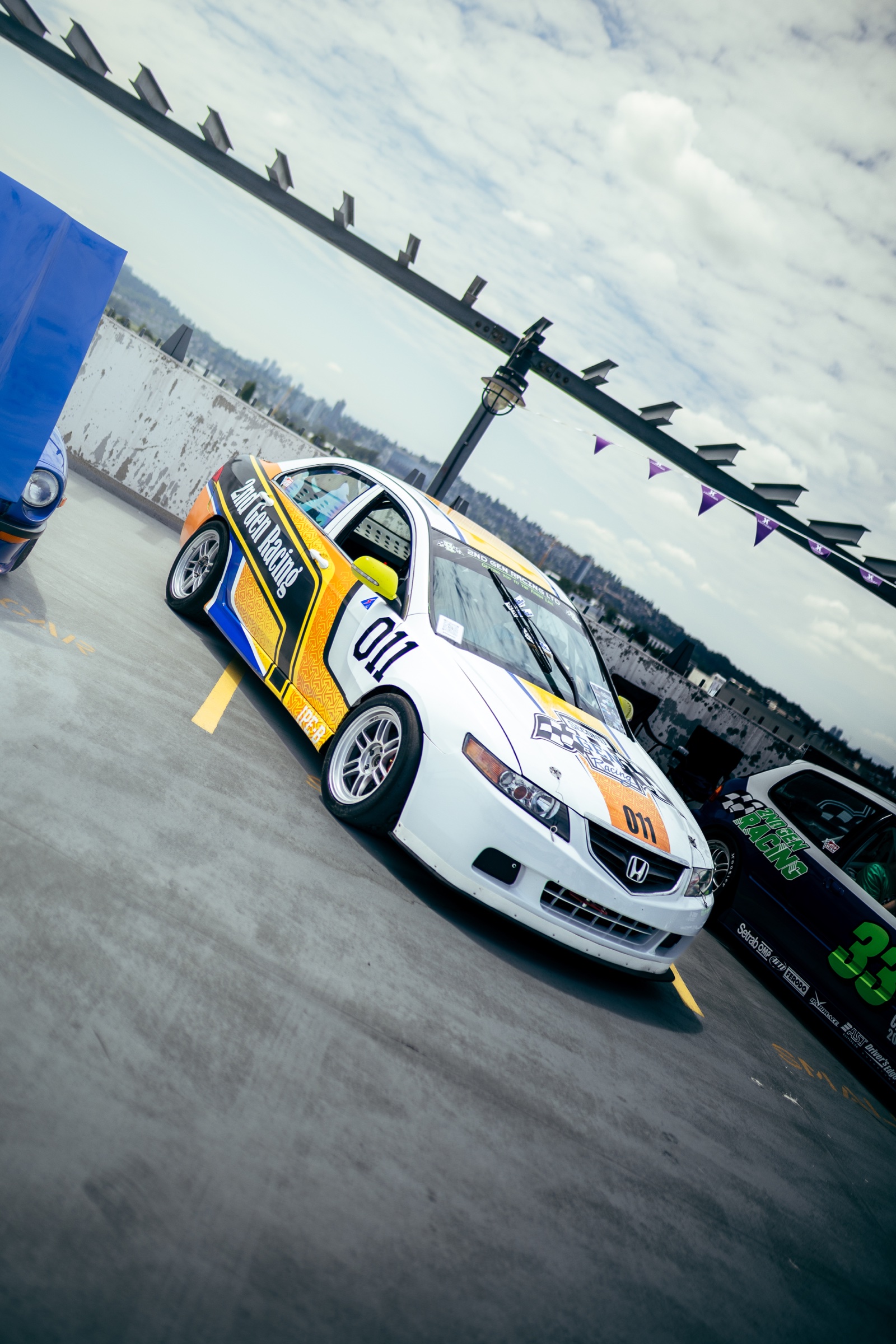 Liveried Honda race car displayed on the rooftop