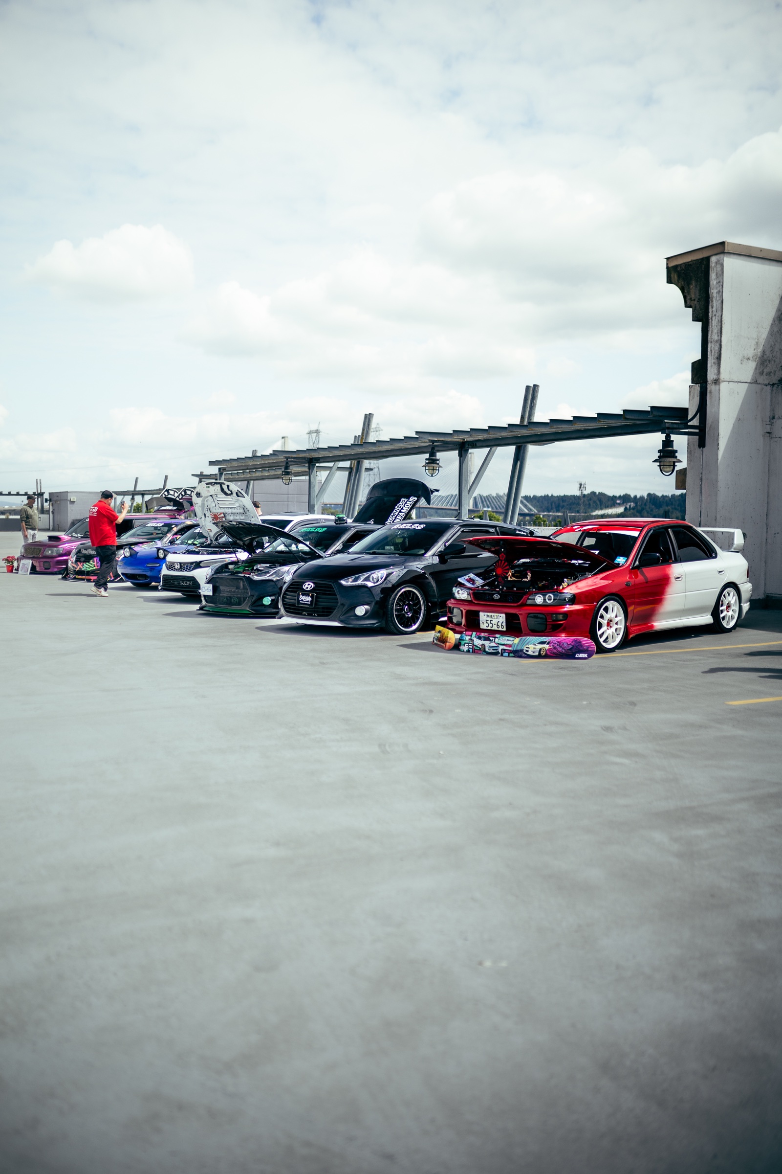 Lineup of modified cars on the Driven Vancouver rooftop