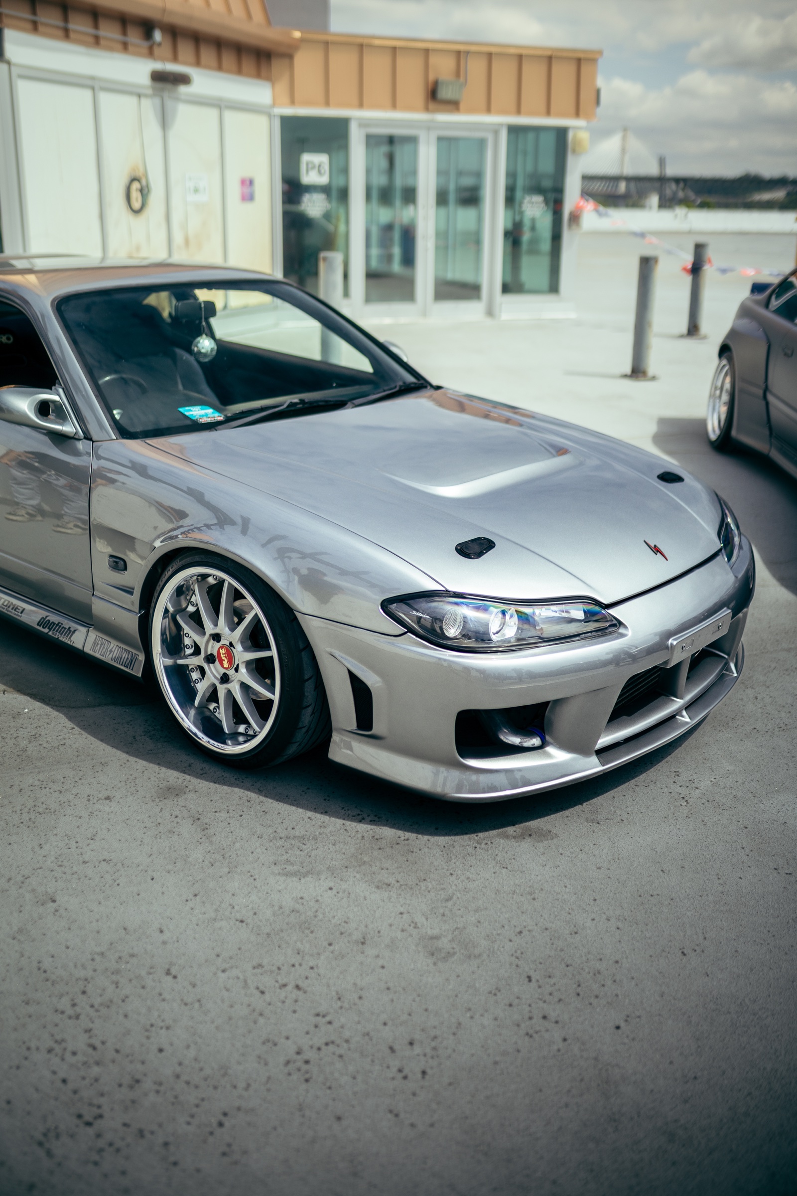 Front three-quarter detail of a silver Nissan Silvia