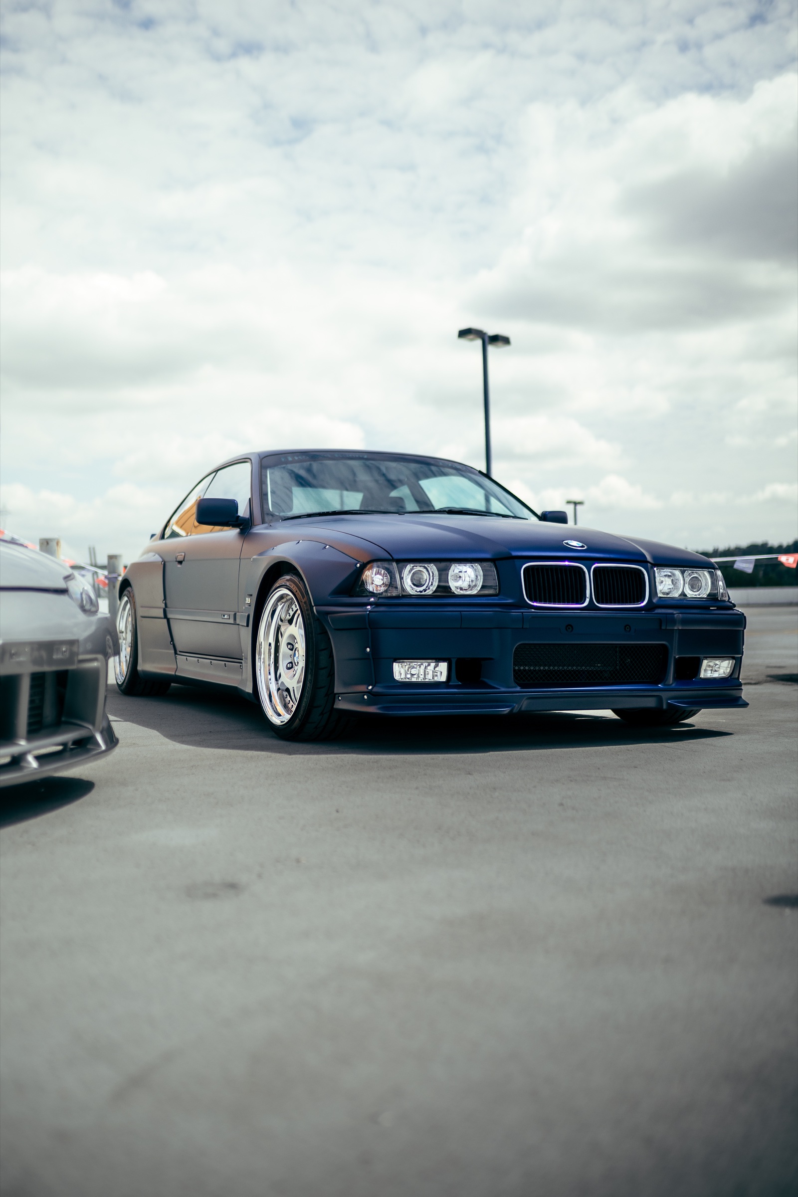 Dark blue BMW E36 displayed at Driven Vancouver 2025