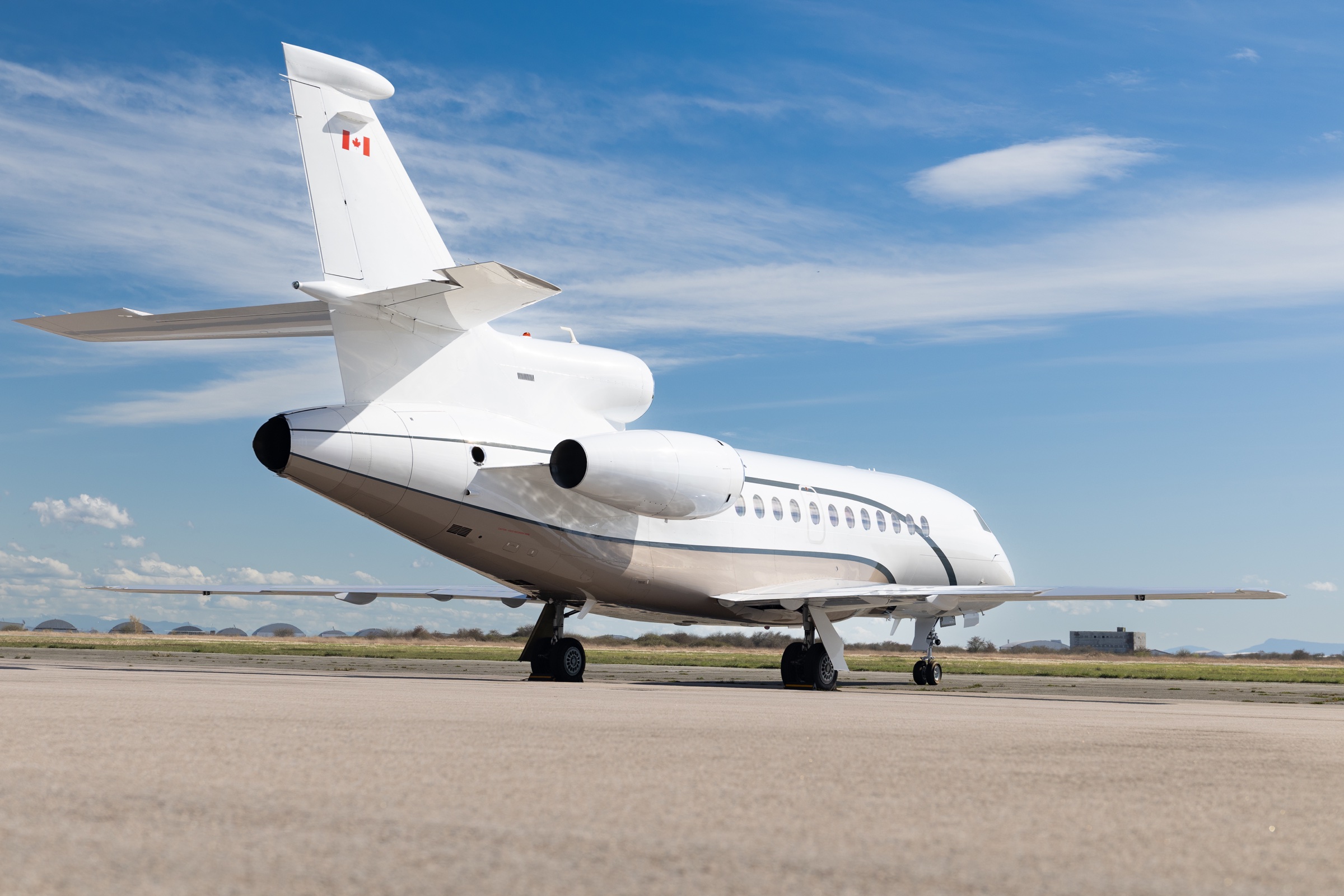 Falcon 900DX rear three-quarter exterior showing its tri-jet layout