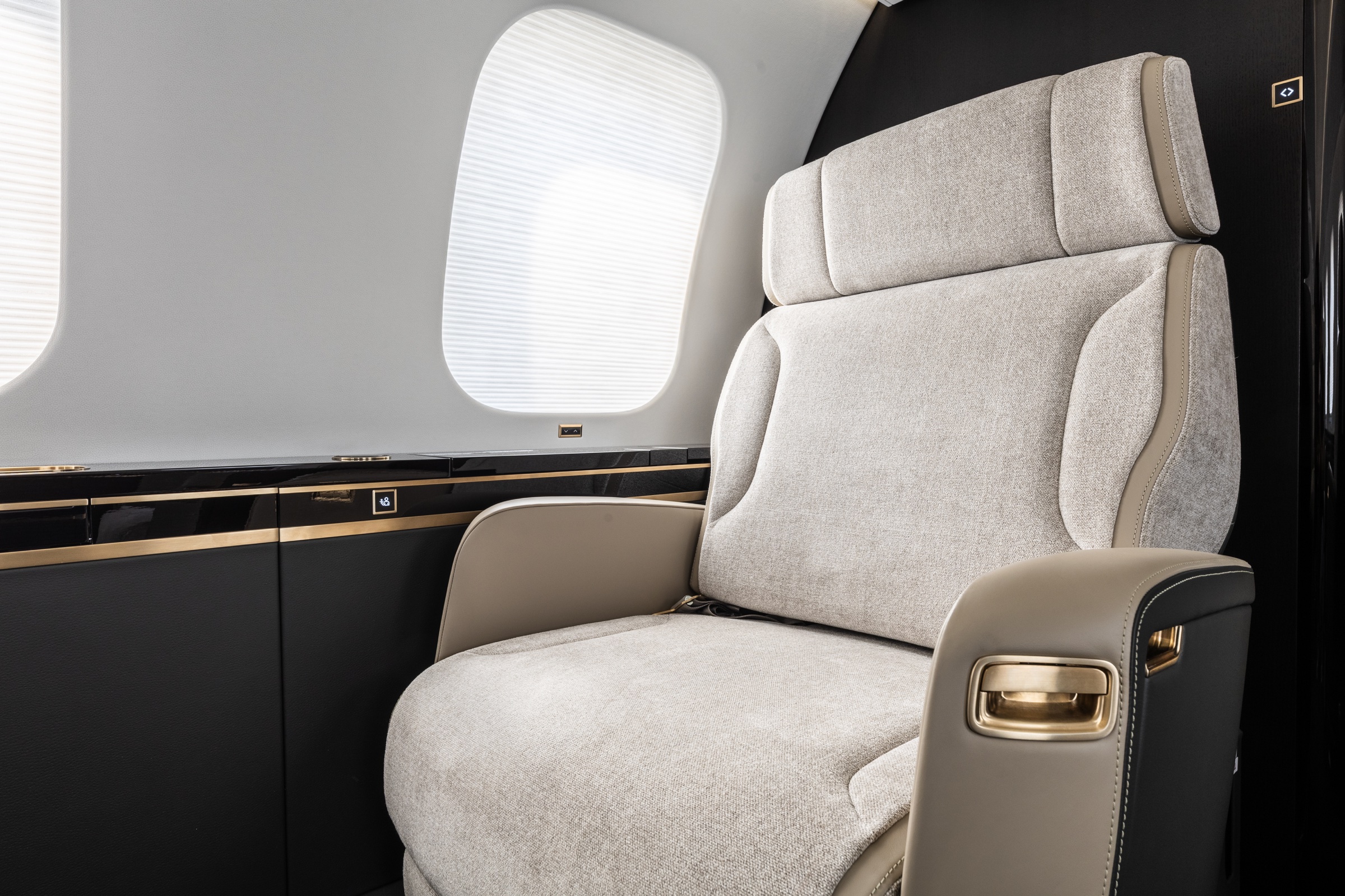 Global 7500 seat and material detail beside a cabin window