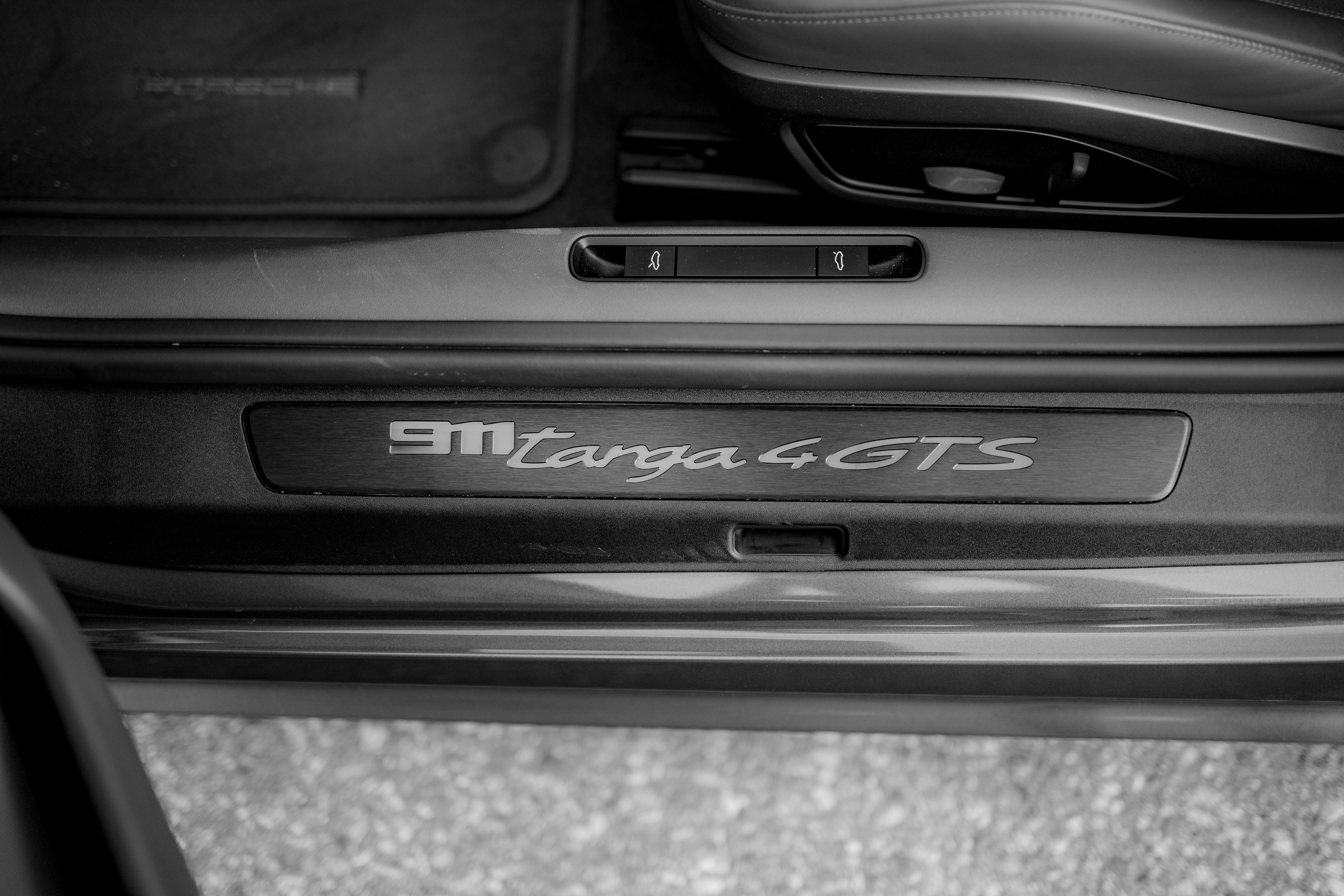 Black-and-white Porsche 911 Targa 4 GTS door-sill detail