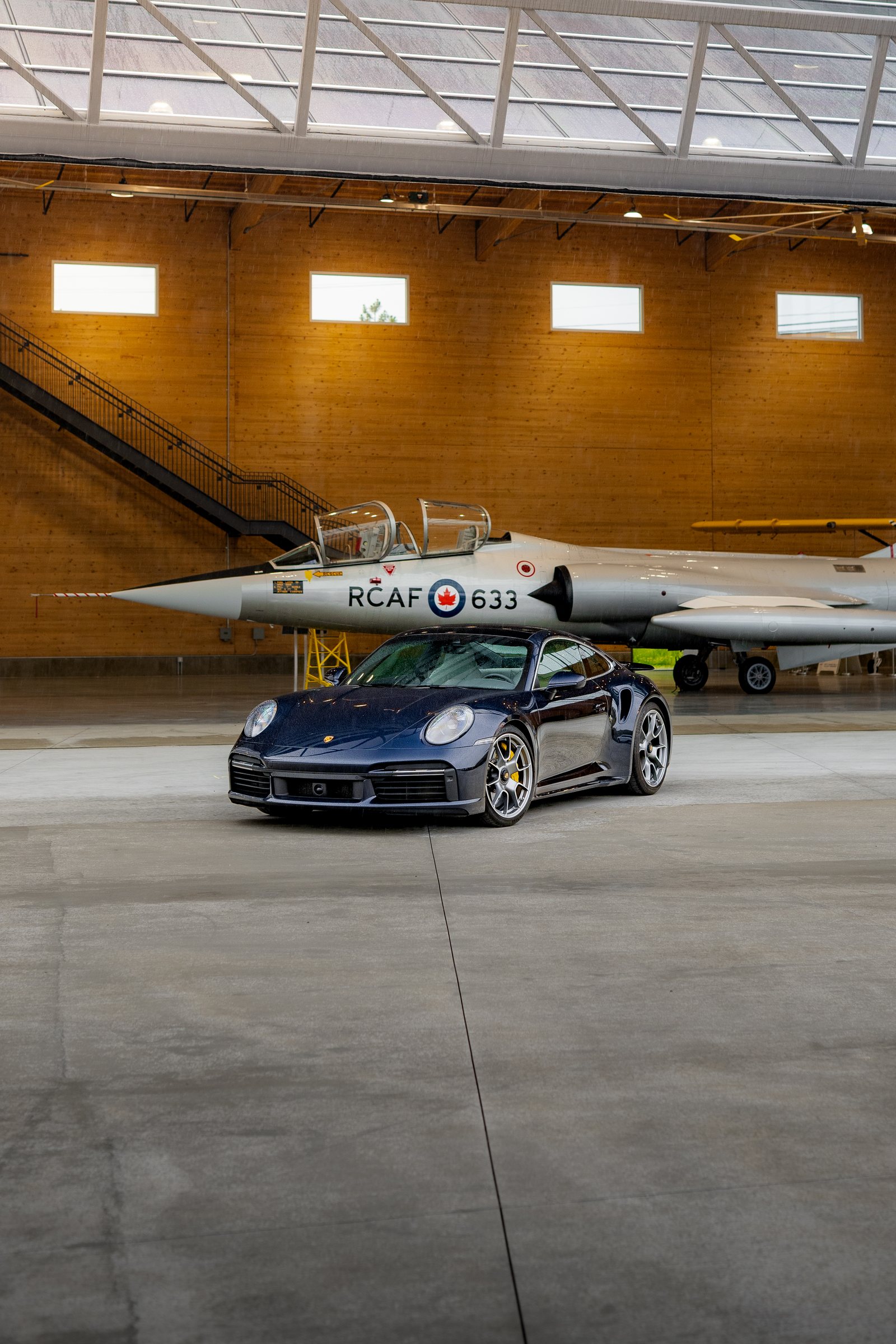 Porsche photographed with an aircraft inside the KF Centre for Excellence