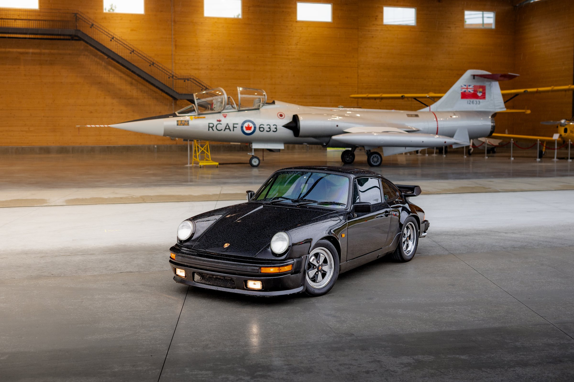 Porsche and aircraft paired inside the KF Centre for Excellence