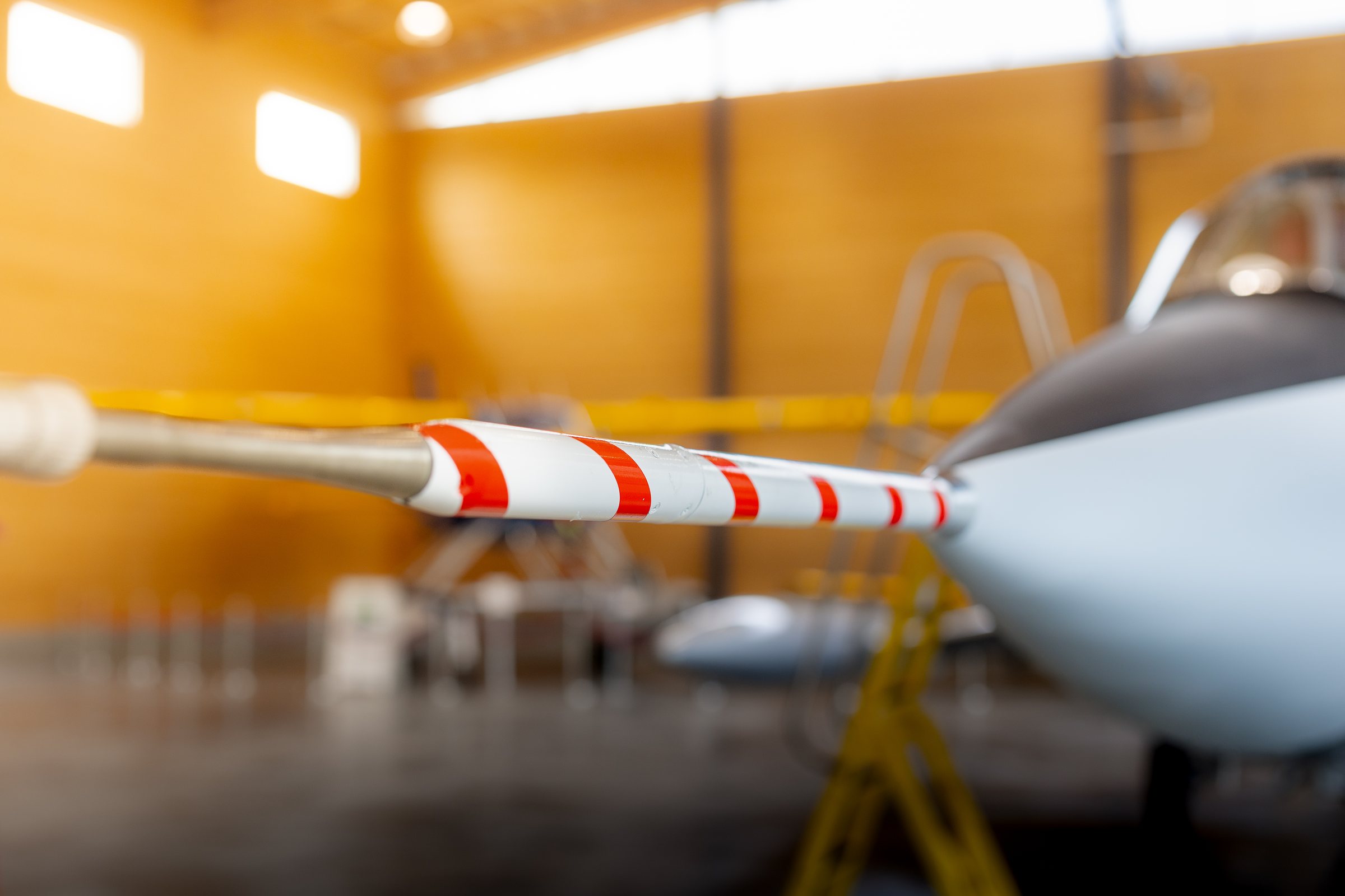 Red-and-white aircraft pitot probe detail