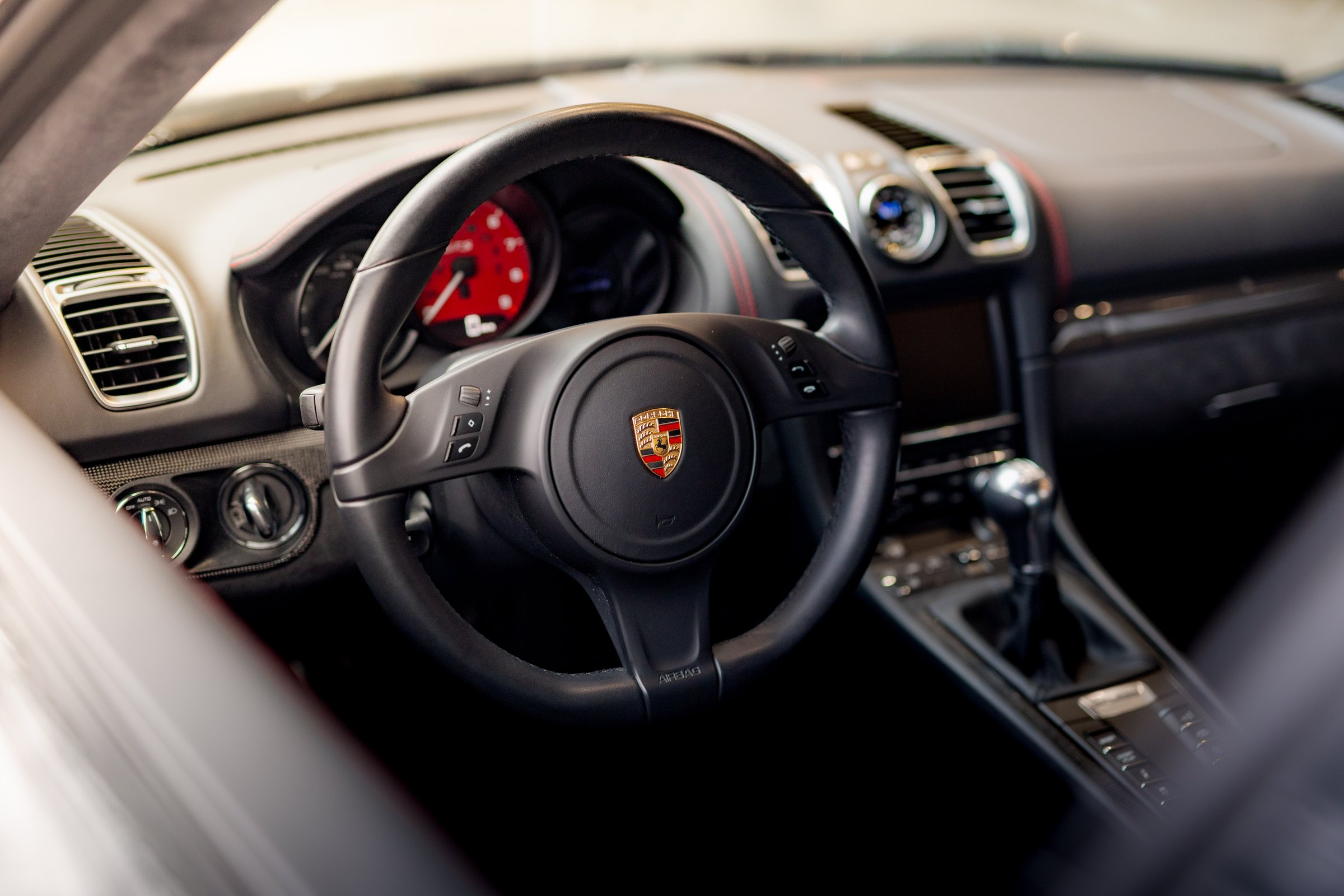 Porsche Cayman steering wheel and interior detail