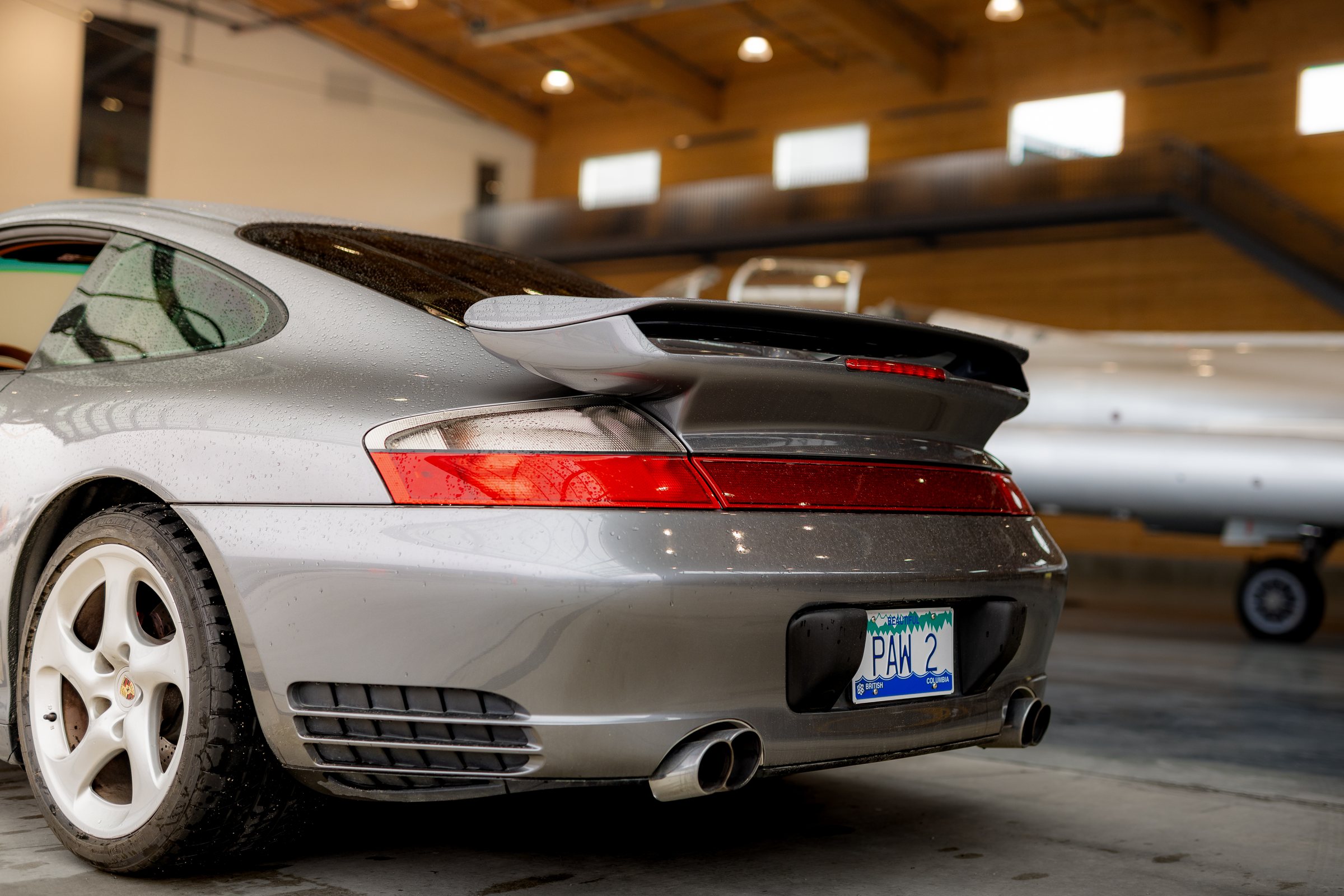 Grey Porsche 911 rear wing and taillight detail