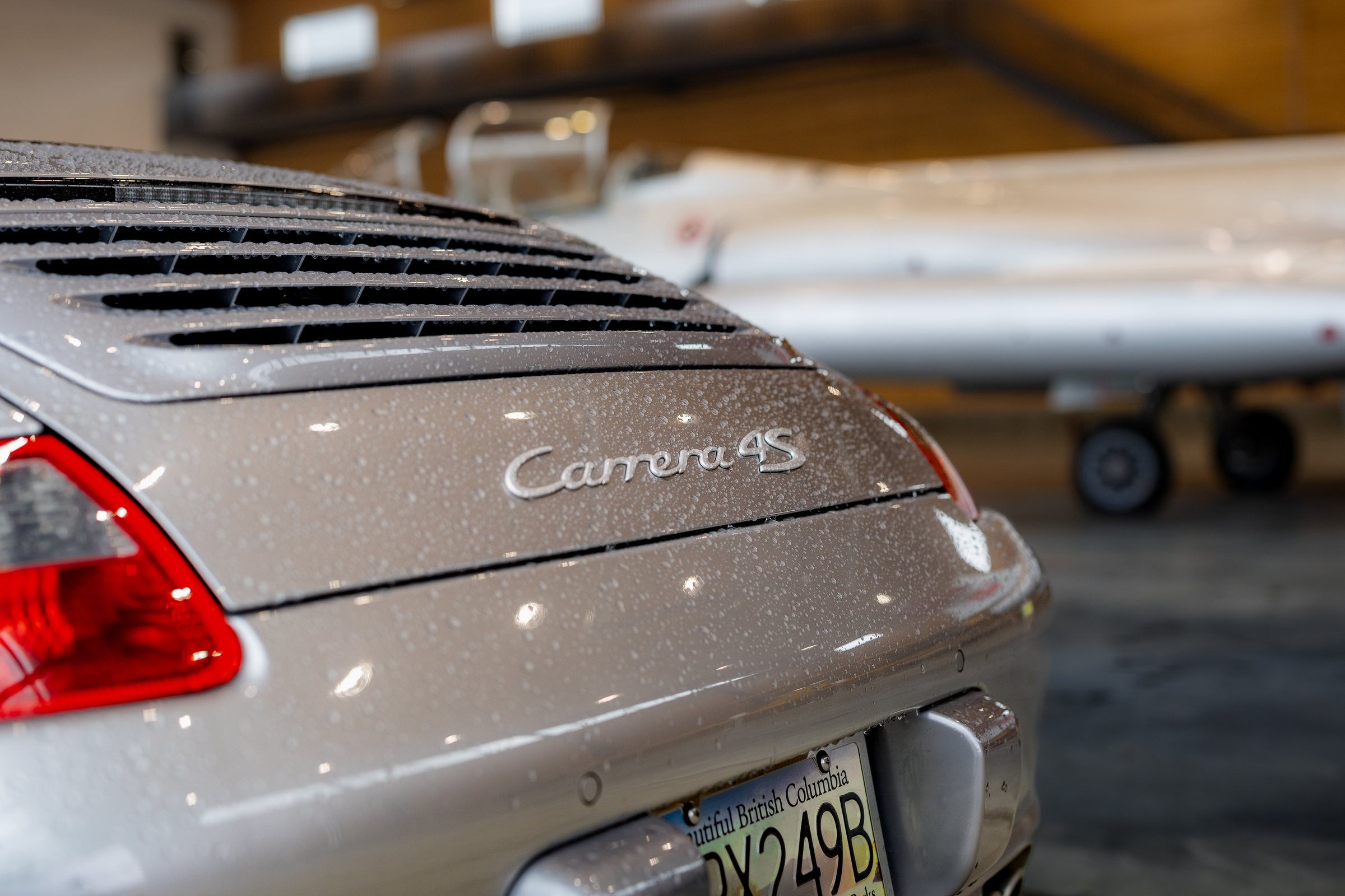 Porsche Carrera 4S rear badge with rain droplets