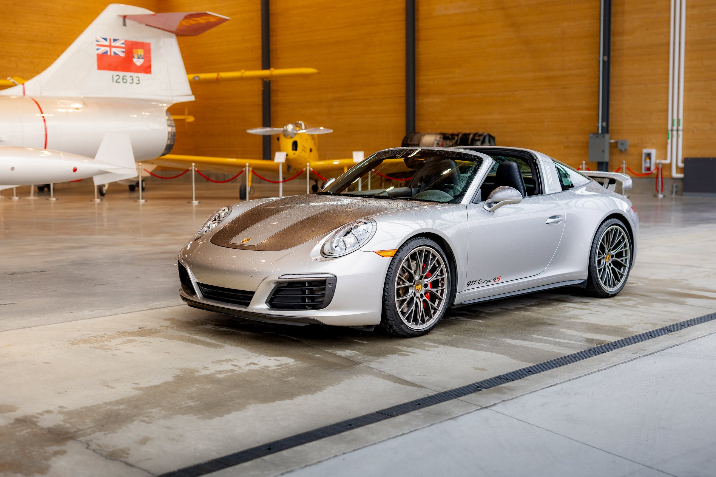 Silver Porsche 911 Targa 4S photographed inside the hangar