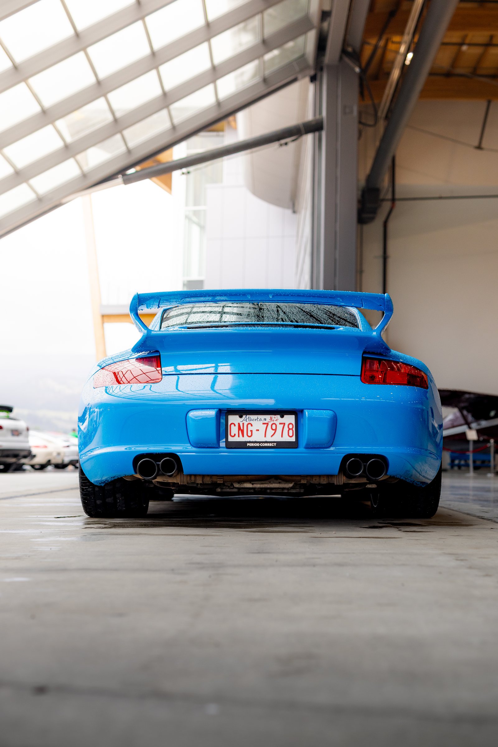 Blue Porsche 911 GT3 photographed from the rear