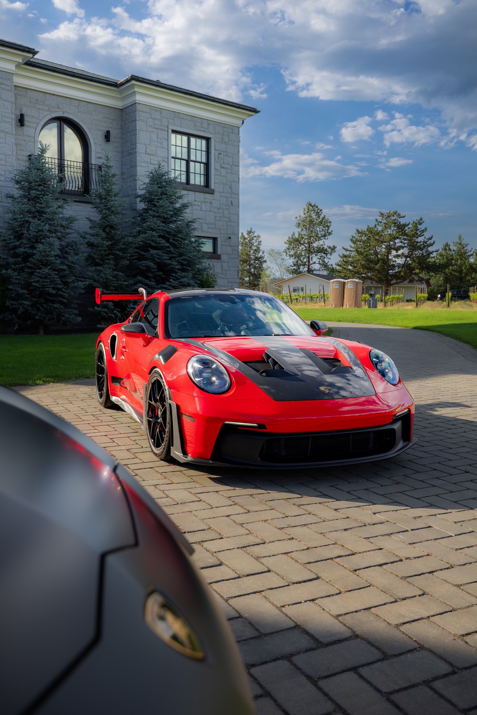 Red Porsche 911 GT3 RS with exposed carbon-fibre bodywork