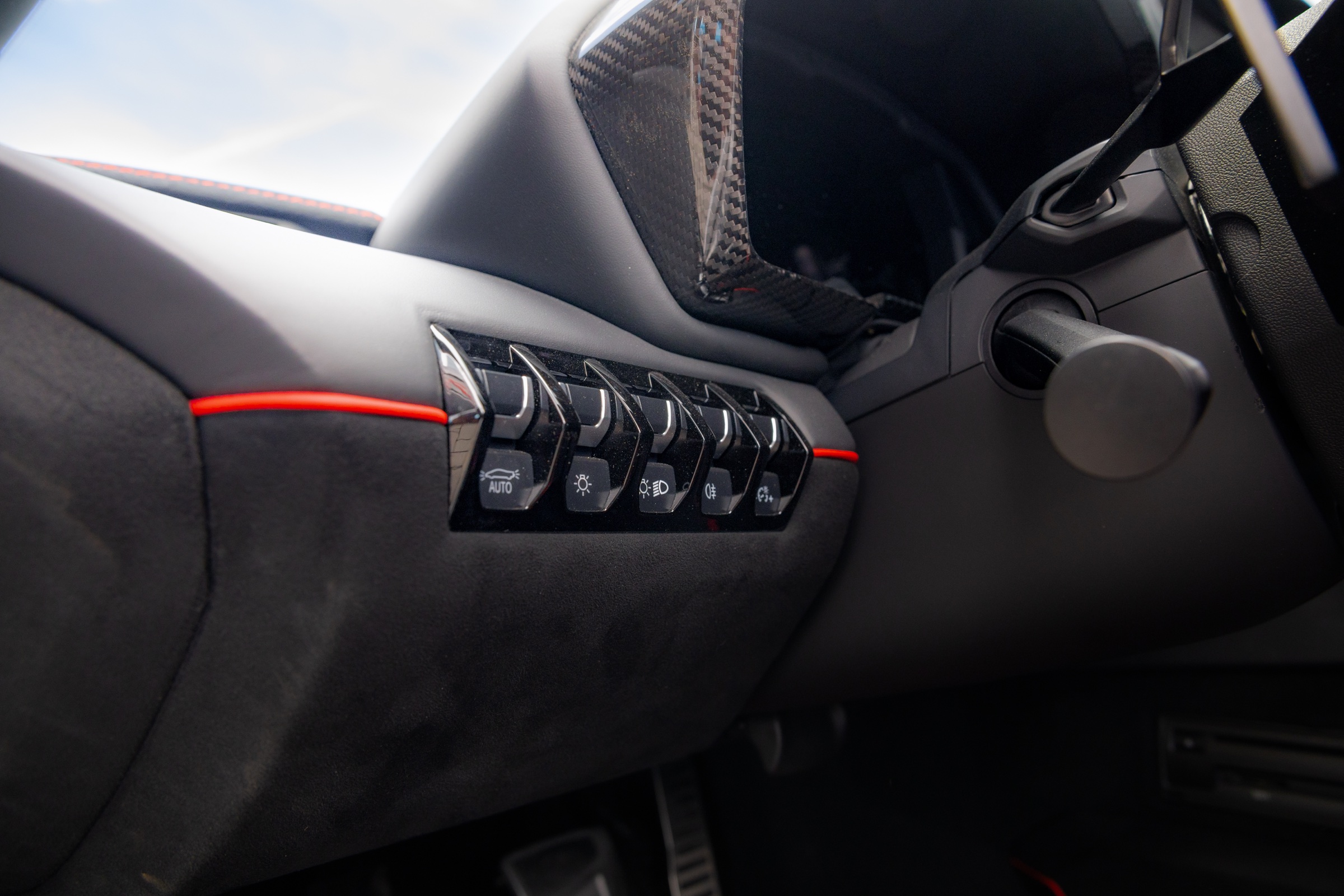 Lamborghini switchgear and carbon-fibre dashboard detail