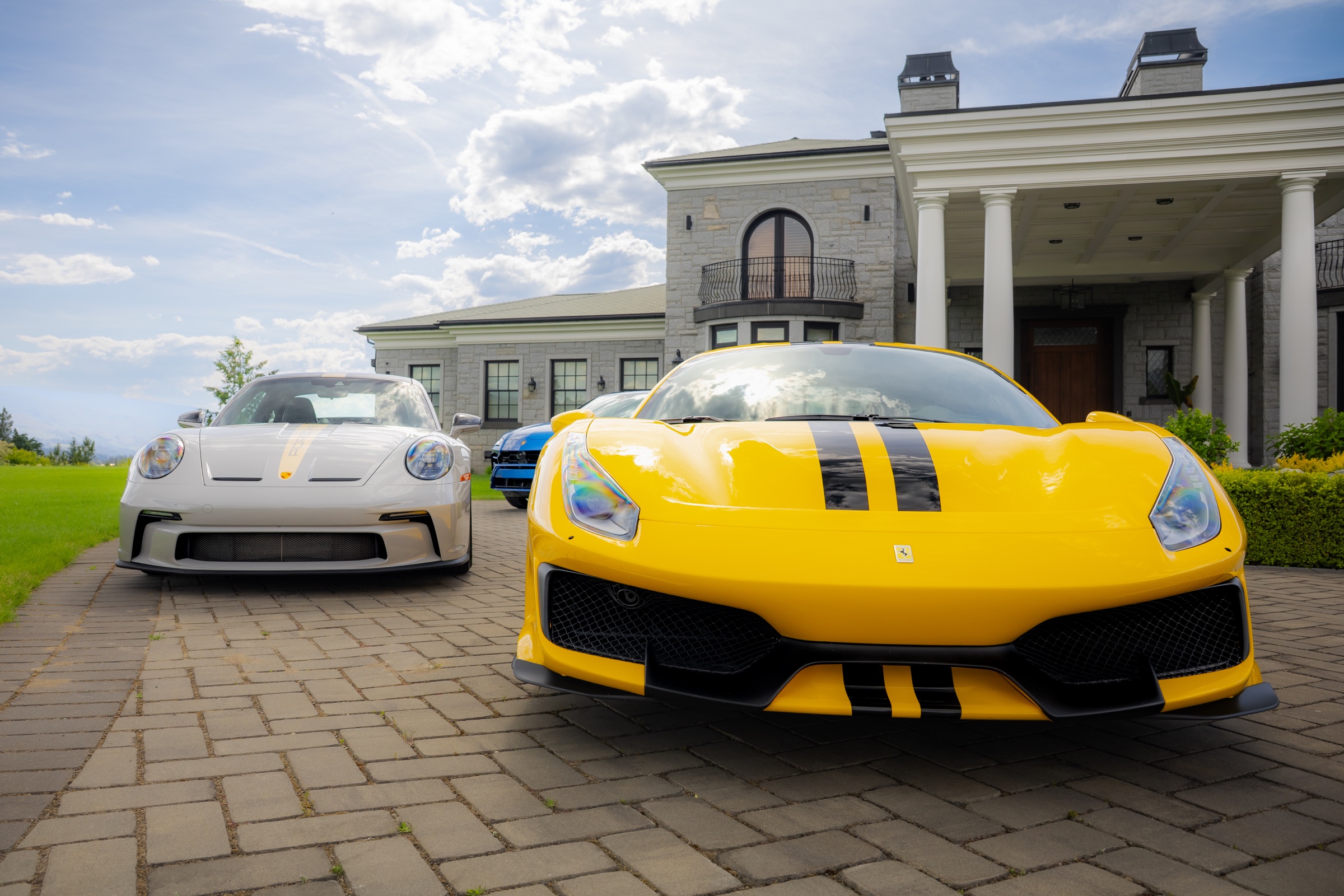 Yellow Ferrari 488 Pista and white Porsche 911 GT3 photographed together